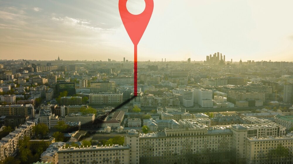 aerial shot of marker pointing on the streets of europe city during sunset b aerial shot of marker pointing on the streets of europe city during sunset