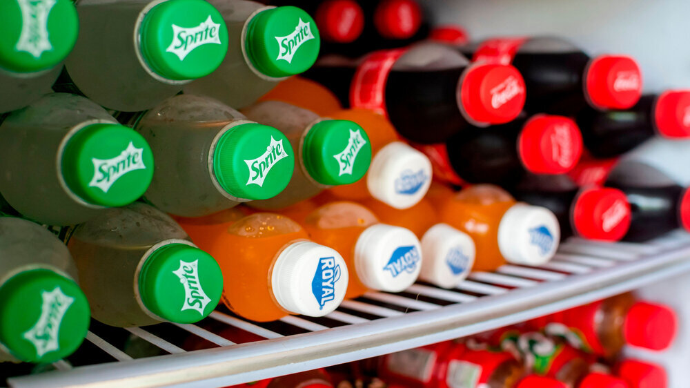 Manila, Philippines - Jan 2022: Sprite, Royal and Coke PET bottles inside a freezer. For sale at a local sari-sari store. Softdrinks