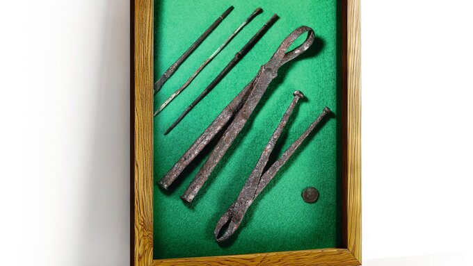 A wooden frame on a white wall with a white background.