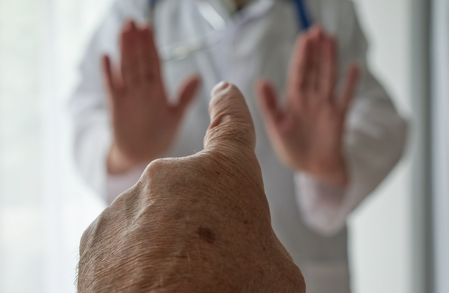 Stop medical staff abuse. Threatening behaviour towards a doctor, Physician. Angry and violent patient. Zero tolerance.