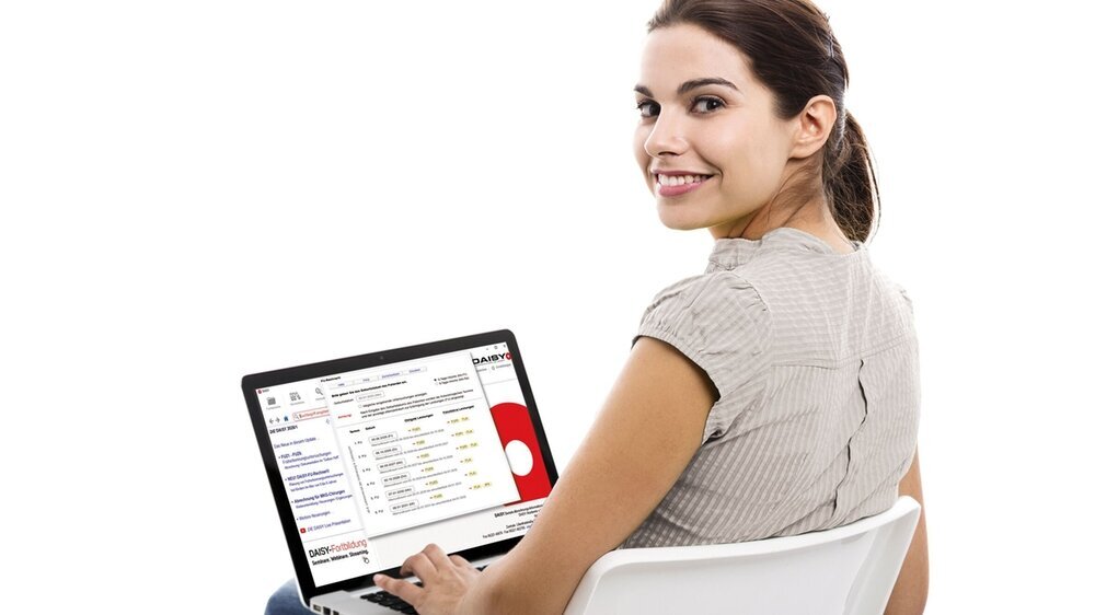 156212447 Beautiful female student sitting on a chair with a laptop, isolated over a white background